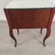 Glass art deco mirror beside table