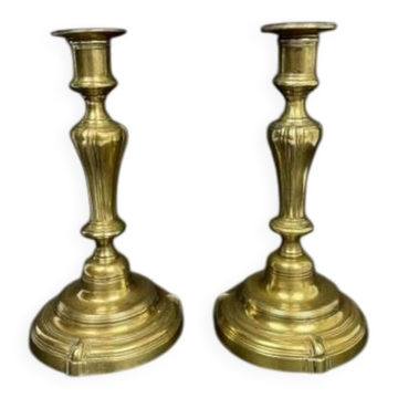 Pair of gilded bronze candlesticks from the Regency period, 18th century.