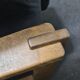Vintage black leather patchwork and oak lounge chair