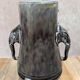 Antique vase in slipware with elephant and flower decoration.