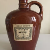 Bottle of Calvados labeled in sandstone
