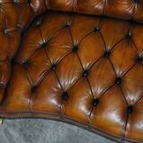 Pair of leather Chesterfield sofas by Howard & Sons