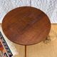 Pretty little vintage round table with tapered legs.
