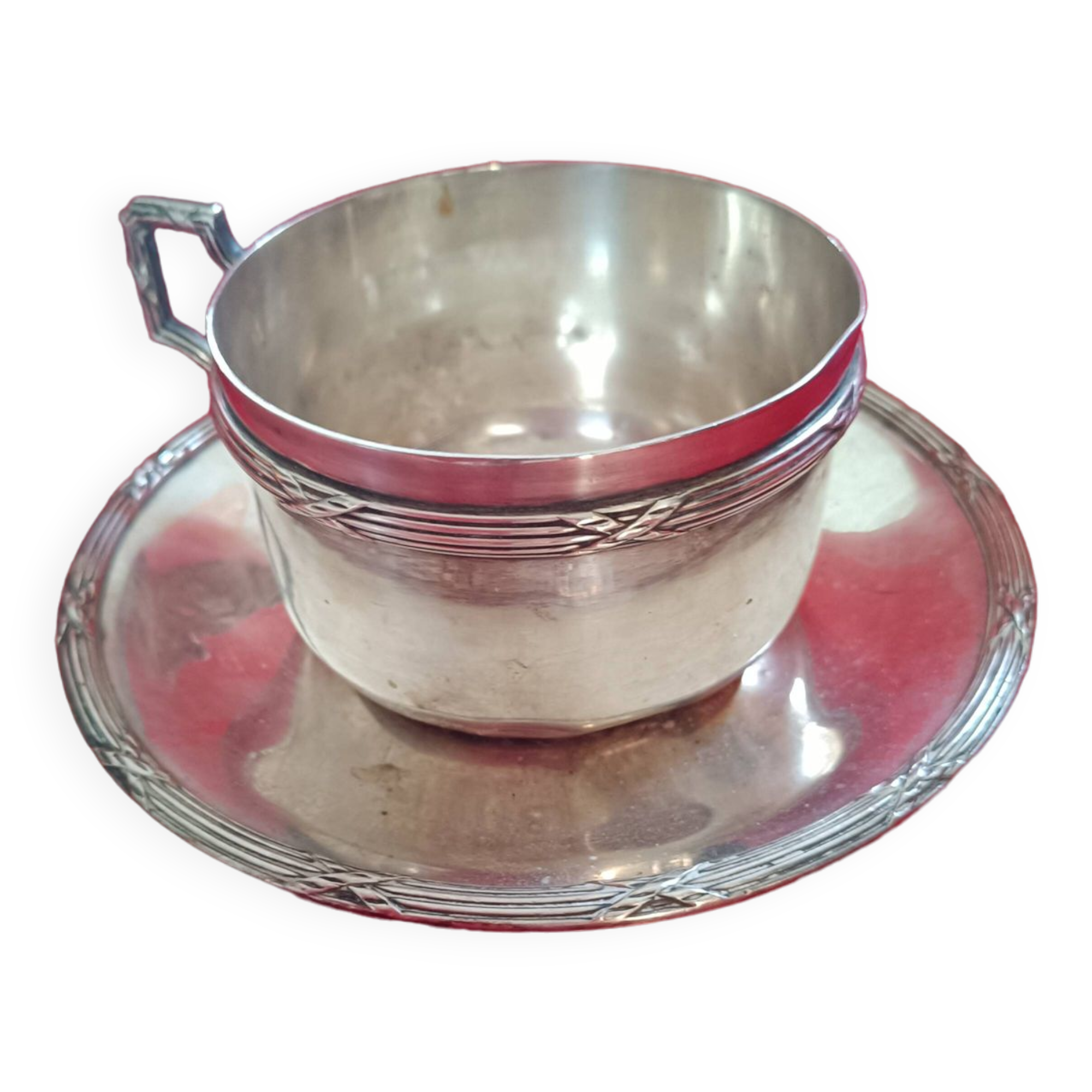 Silver-plated cup and saucer.