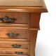 Antique walnut commode with bronze handles in the shape of a lion's mask,