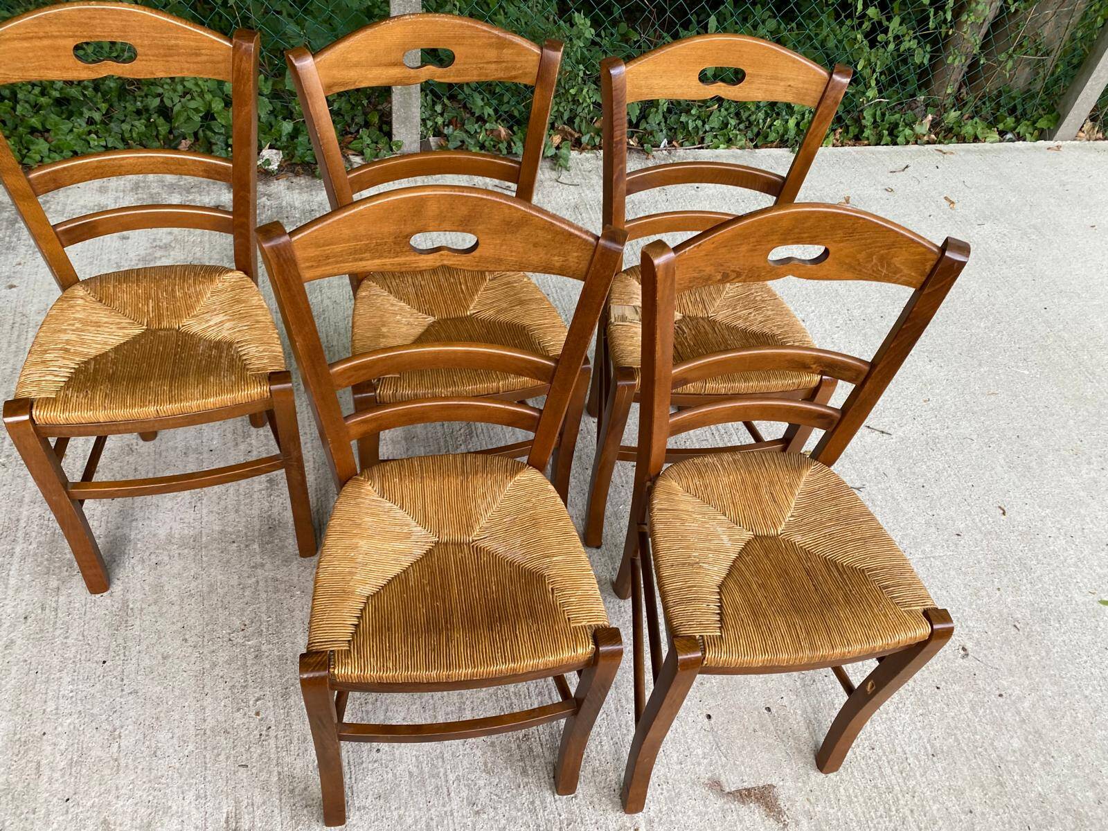 12 solid wood and straw chairs