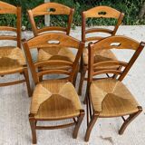 12 solid wood and straw chairs