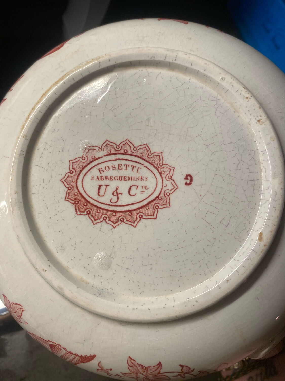 Old pitcher in red-decorated earthenware.