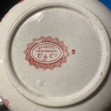 Old pitcher in red-decorated earthenware.