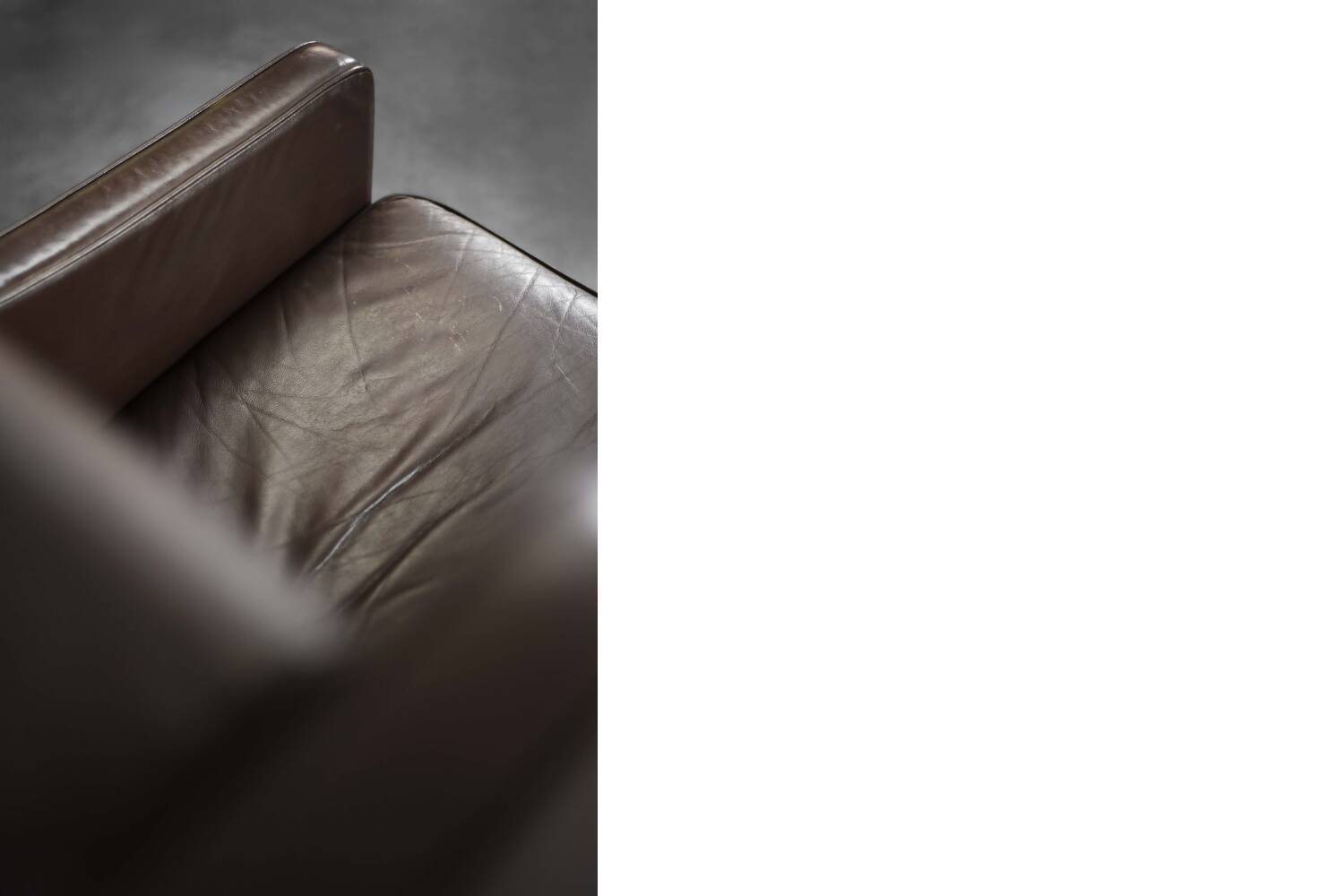 Brown leather wingback chair in mid-century modern Danish style, 1960s.