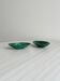 Mini bowls in malachite for jewellery or rings.