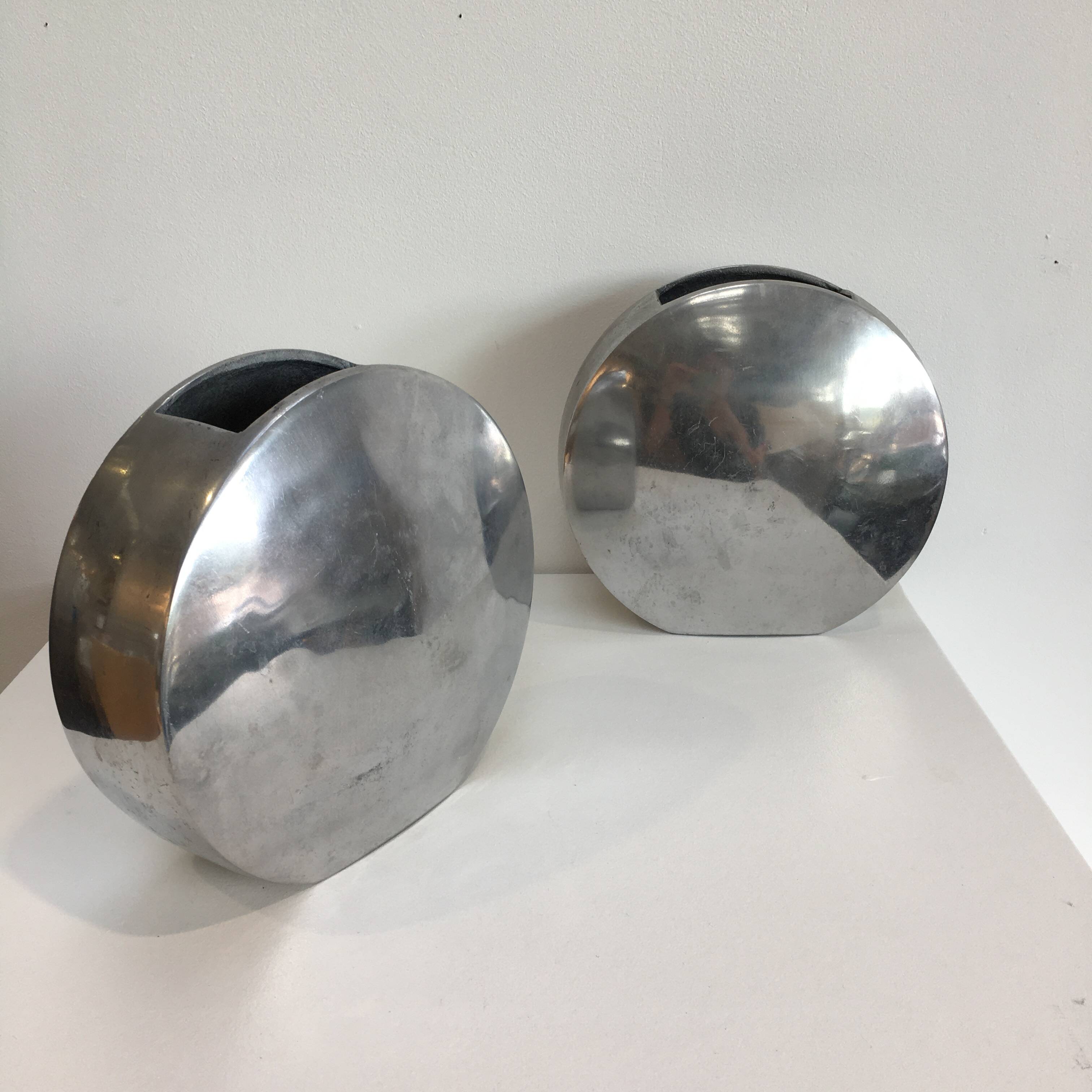 Series of two 70s style aluminum vases