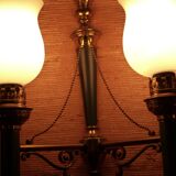 Brass wall sconce and frosted globe