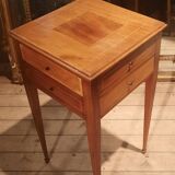 Nightstand with veneer and 4 drawers.