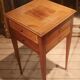 Nightstand with veneer and 4 drawers.