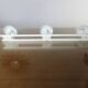White lacquered metal wall coat rack with 3 hooks, 1970.