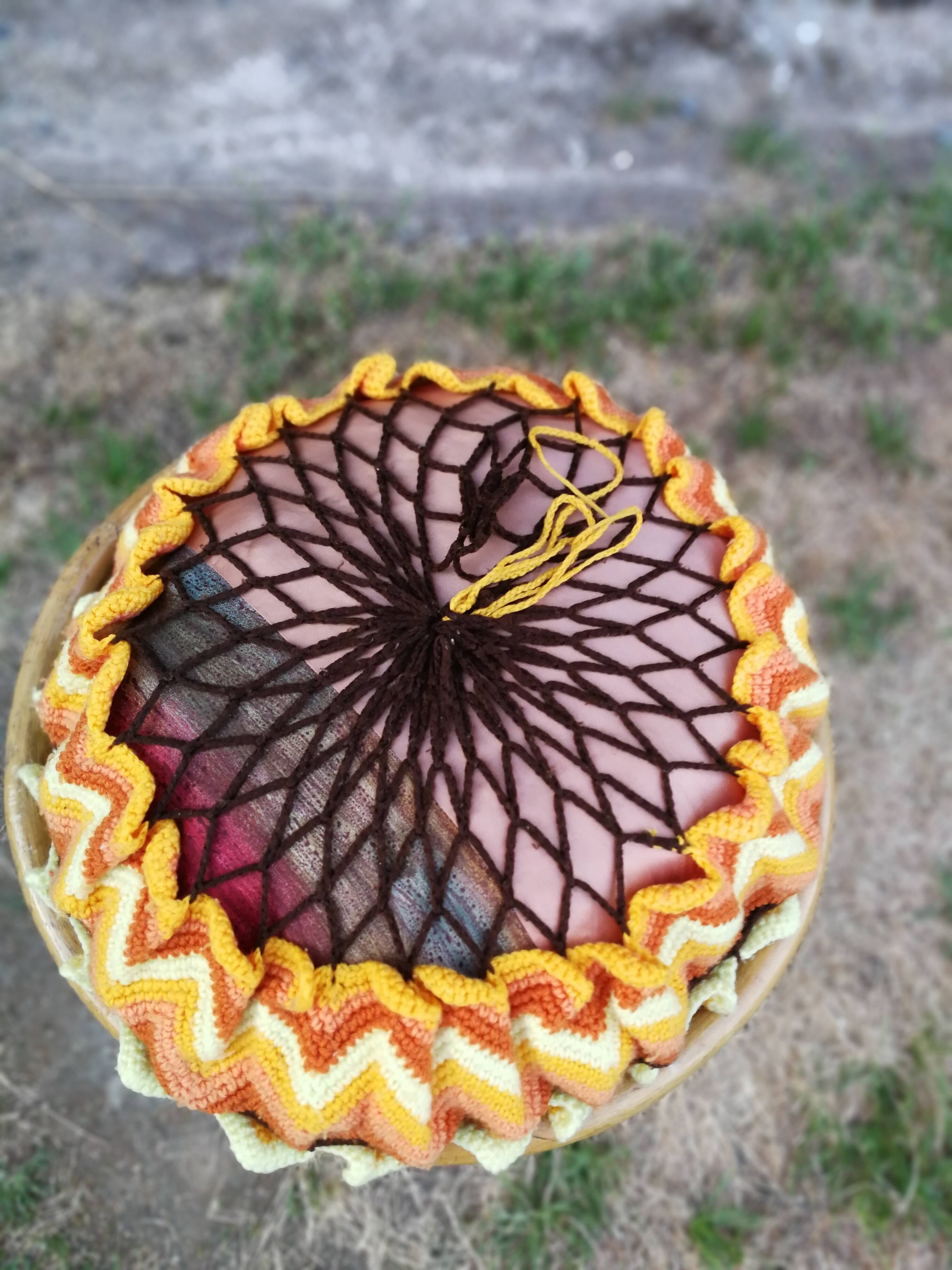 Rattan pouf and its 70's cushion