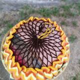 Rattan pouf and its 70's cushion