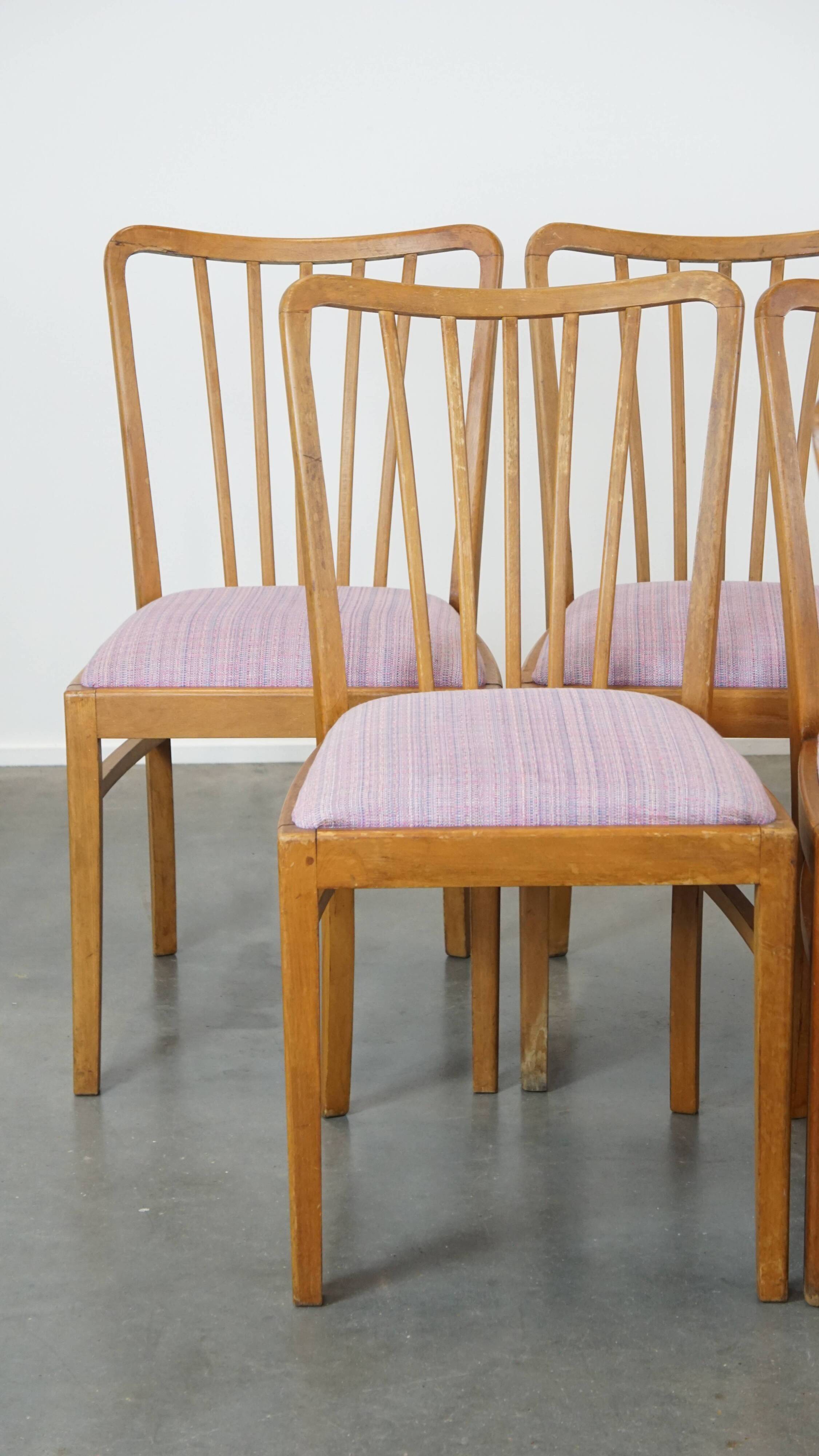 Set of 8 vintage Danish design dining chairs from the 1970s with light purple fabric seats