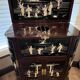 "Chinese black lacquer cabinet, mother-of-pearl inlays, court scenes"