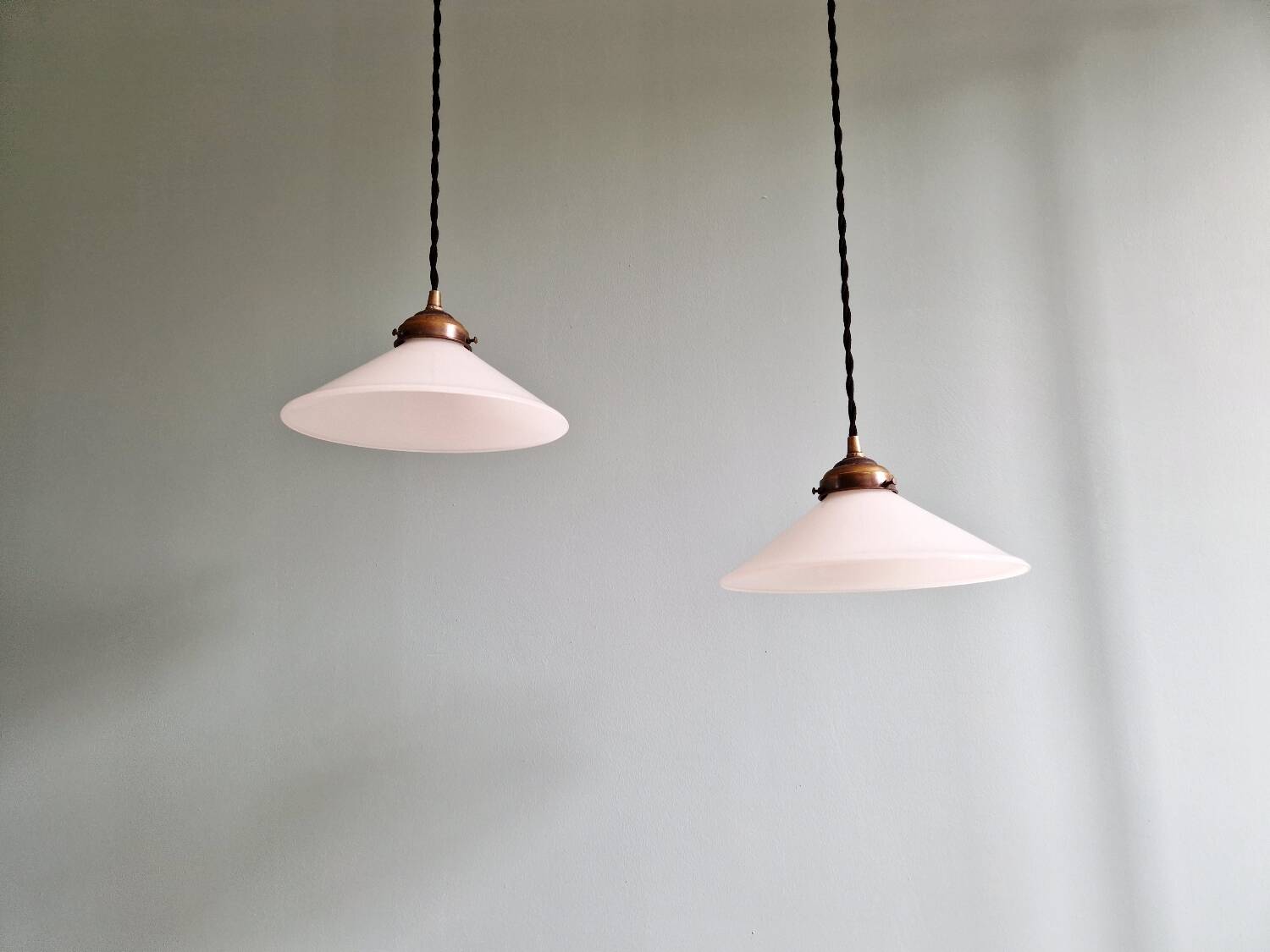 Pair of Art Deco conical white opaline pendants, 1920-30.