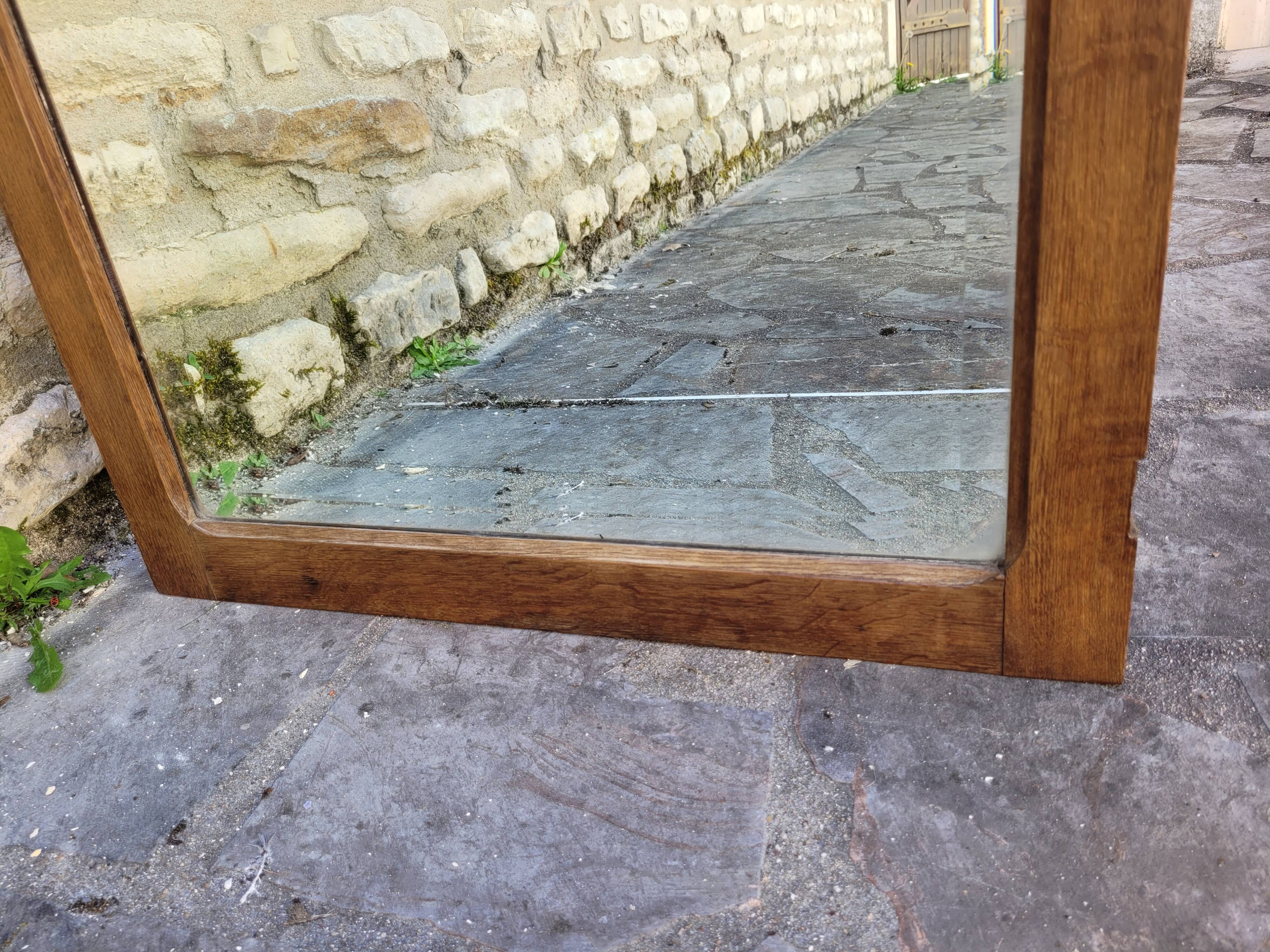 Art Deco oak mirror with bevelled glass from the 1930s.