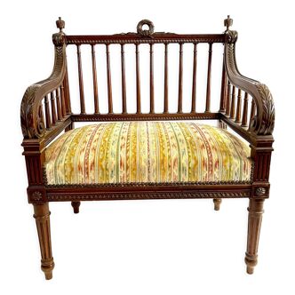 Old Louis XVI style armchair with wide seat