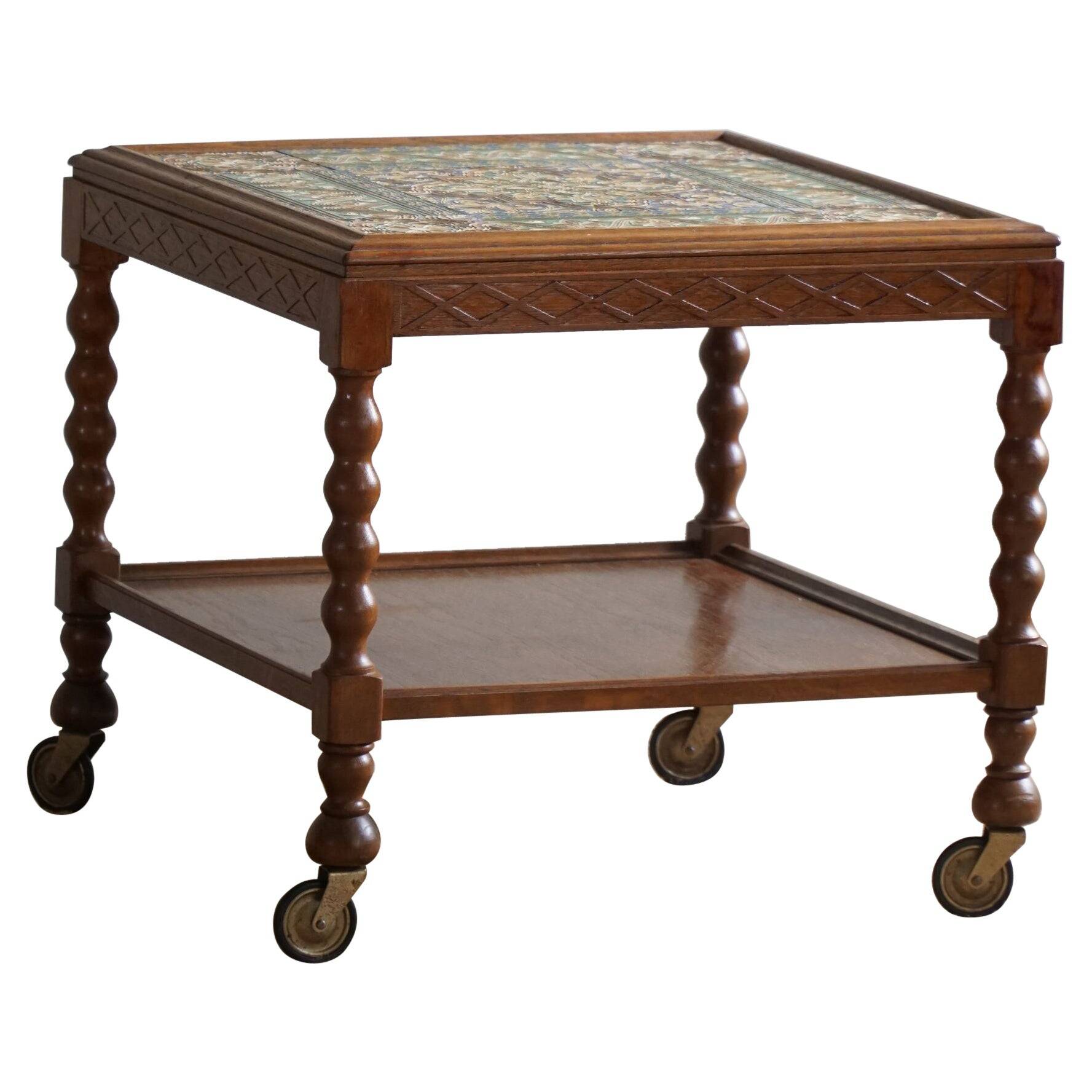 Modern Danish service table with turned spool legs and coloured tiles, 1950s.