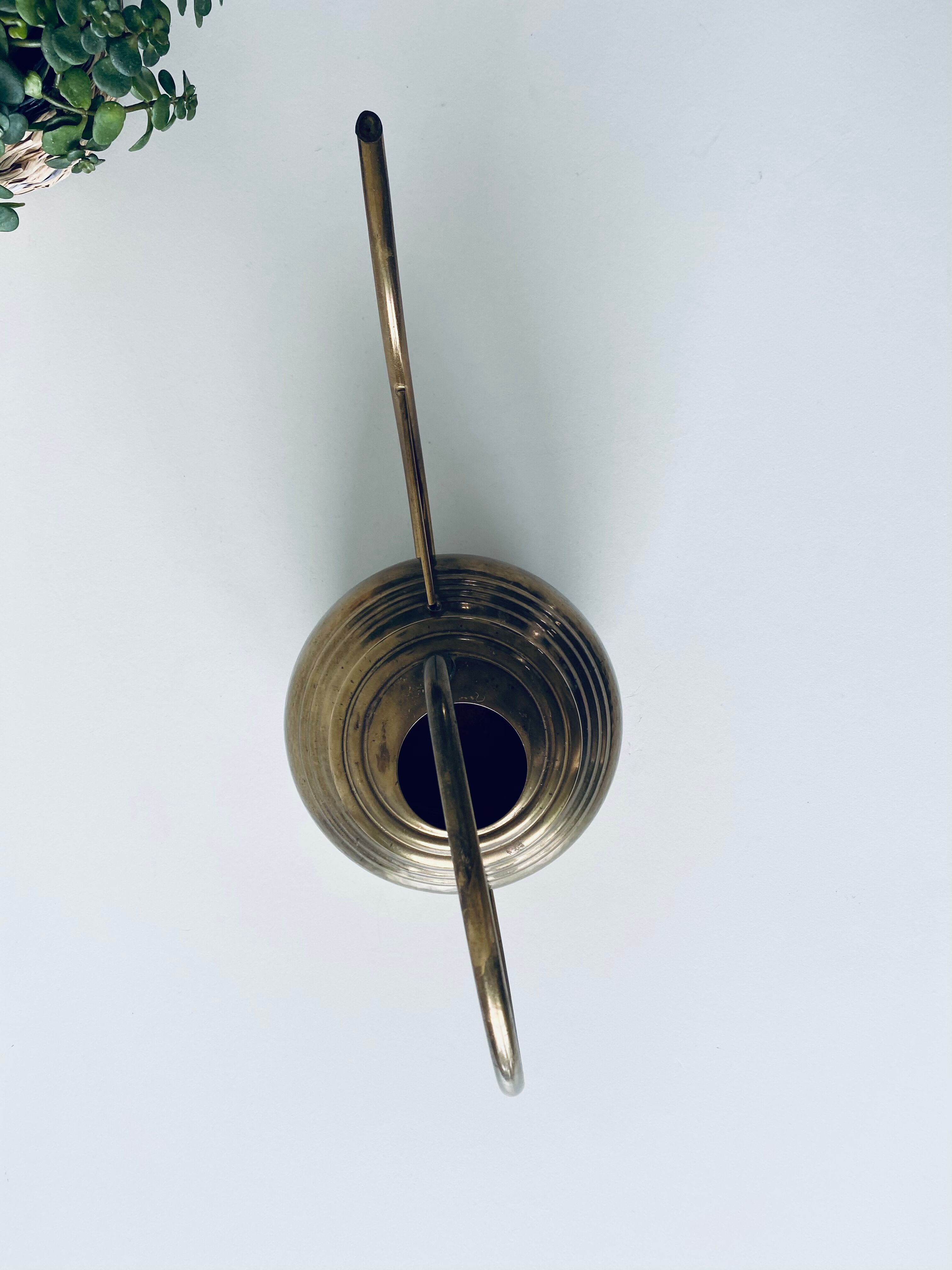 Old brass watering can