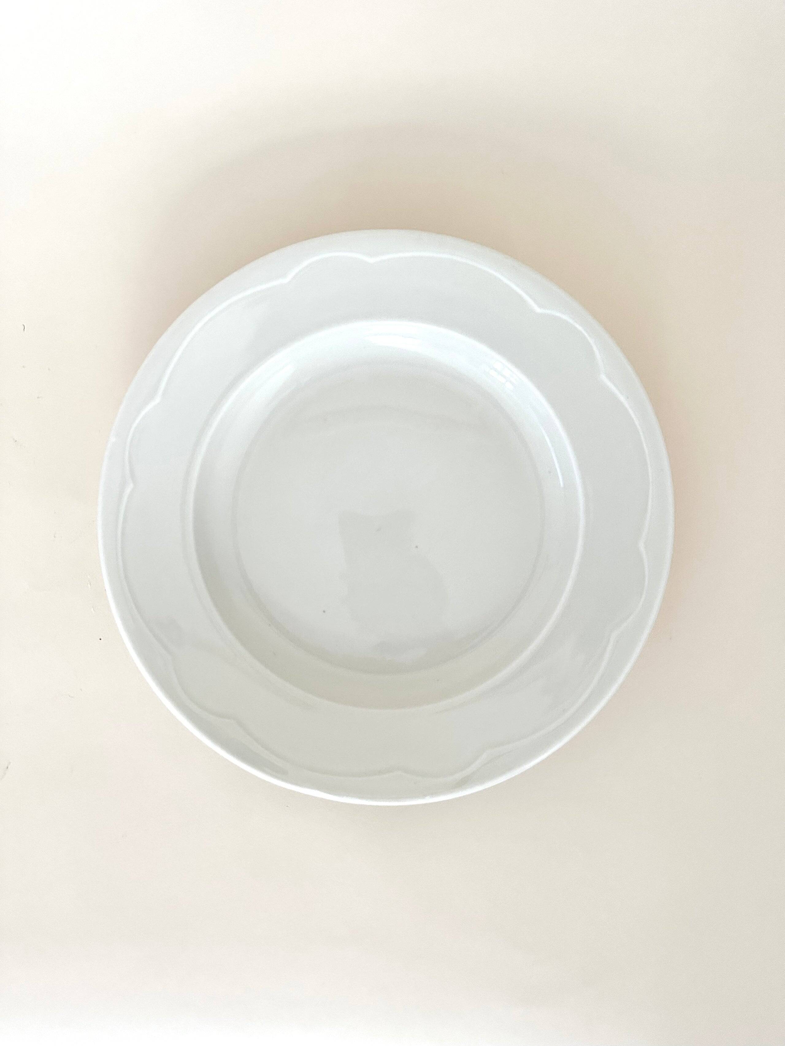 Set of six white porcelain deep plates by Pillivuyt.
