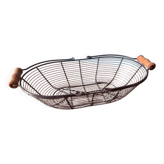 Old metal egg basket with wooden handle