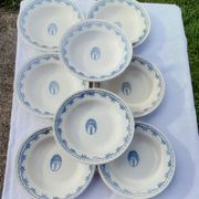 8 hollow plates in F J earthenware with frieze and central bouquet