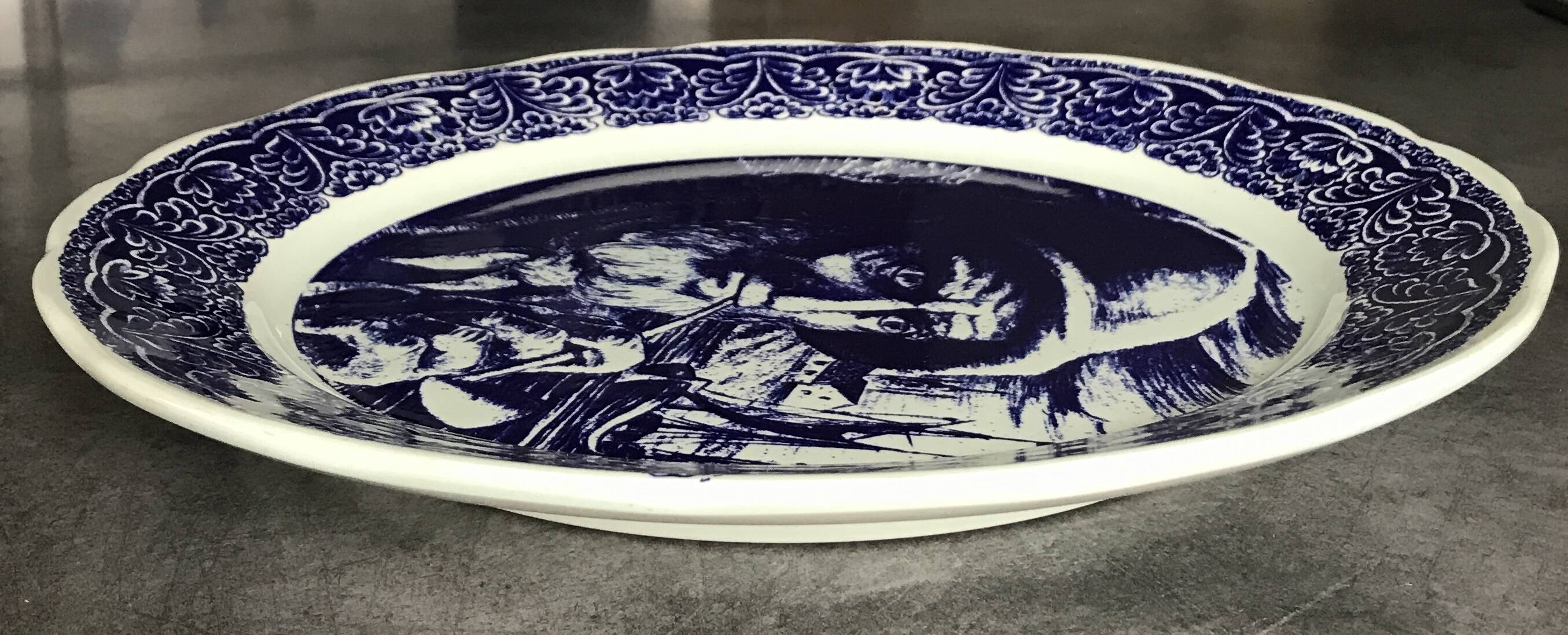 Blue enamelled earthenware wall plate with fisherman decor, Boch La Louvière, Belgium