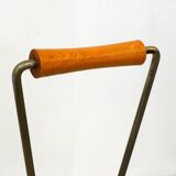 Mid-century openwork magazine rack, in gold metal & wooden handle.