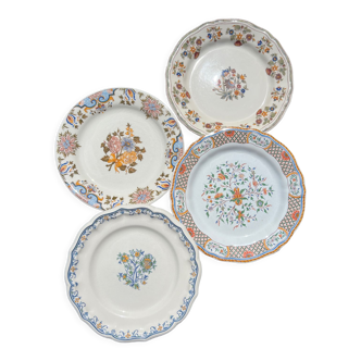 Composition de 4 assiettes plates en faïence, gien