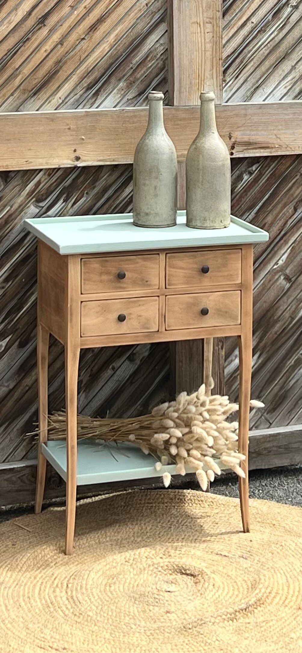 Raw wood console in water green with 4 drawers.