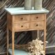 Raw wood console in water green with 4 drawers.