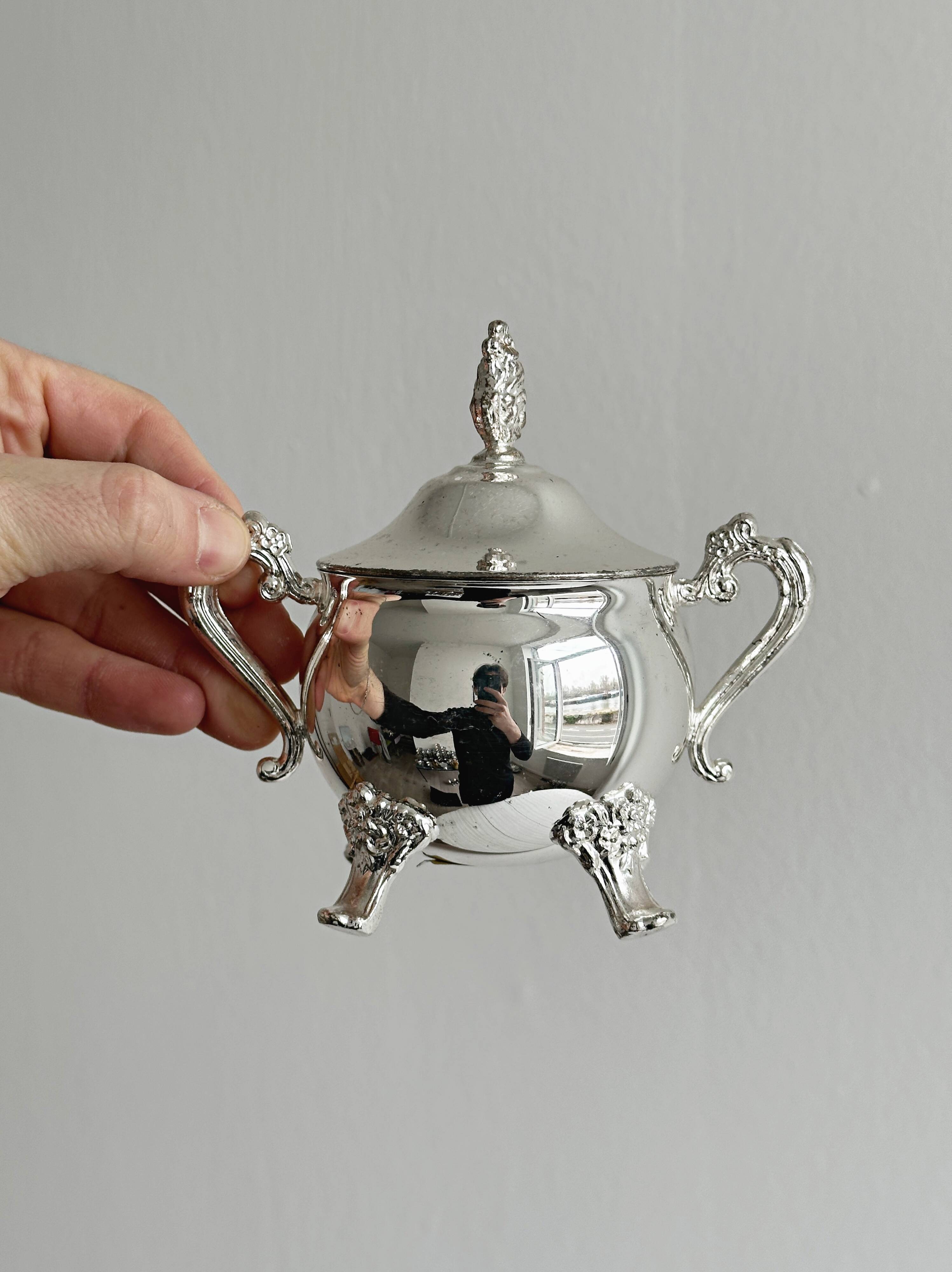 Antique shiny metal sugar bowl