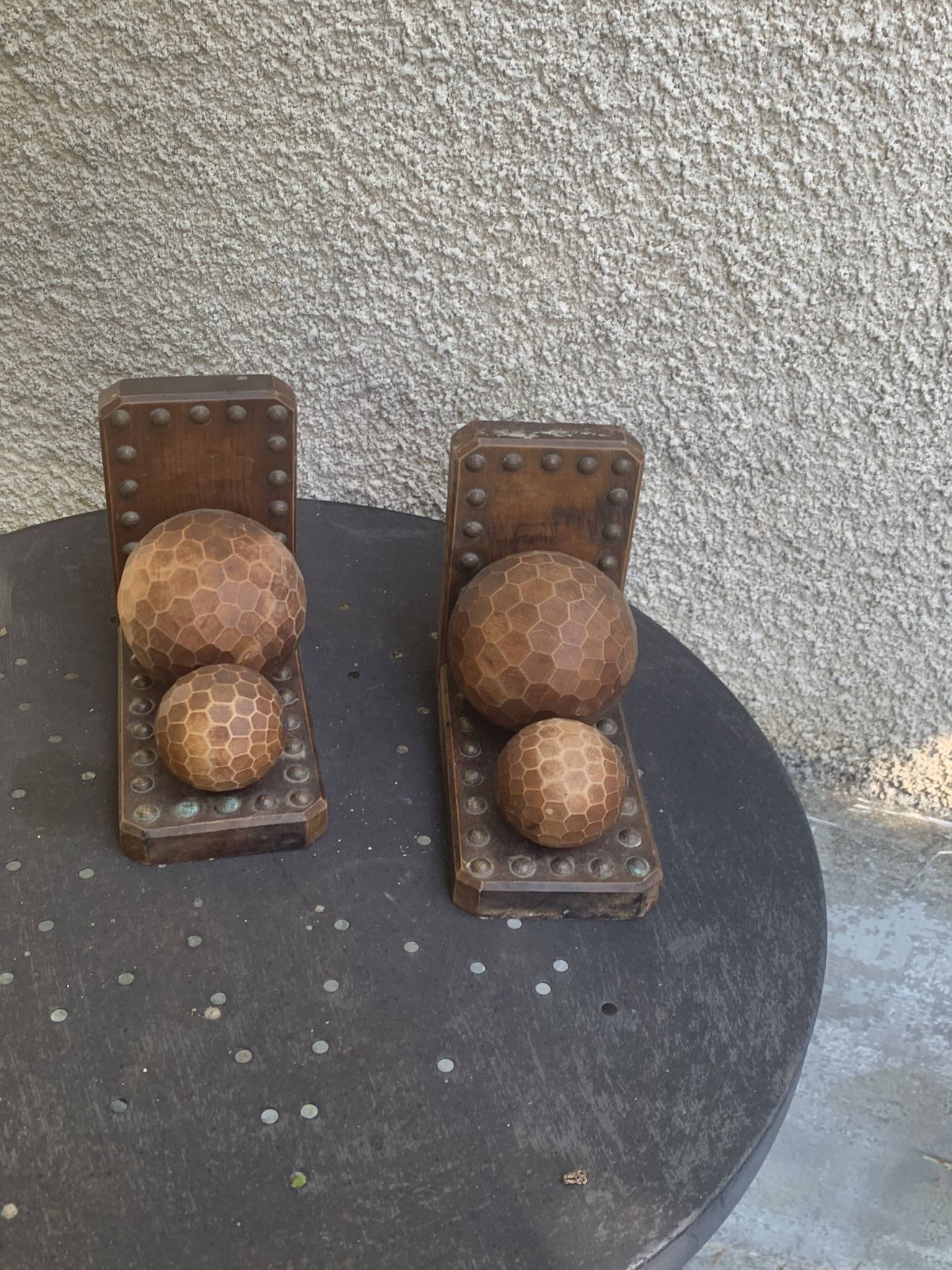 Pair of vintage carved wood and metal ball bookends