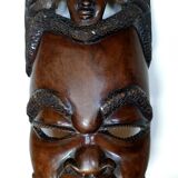 Enigmatic face of Africa carved in ebony wood