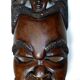 Visage énigmatique d'Afrique sculpté en bois d'ébène