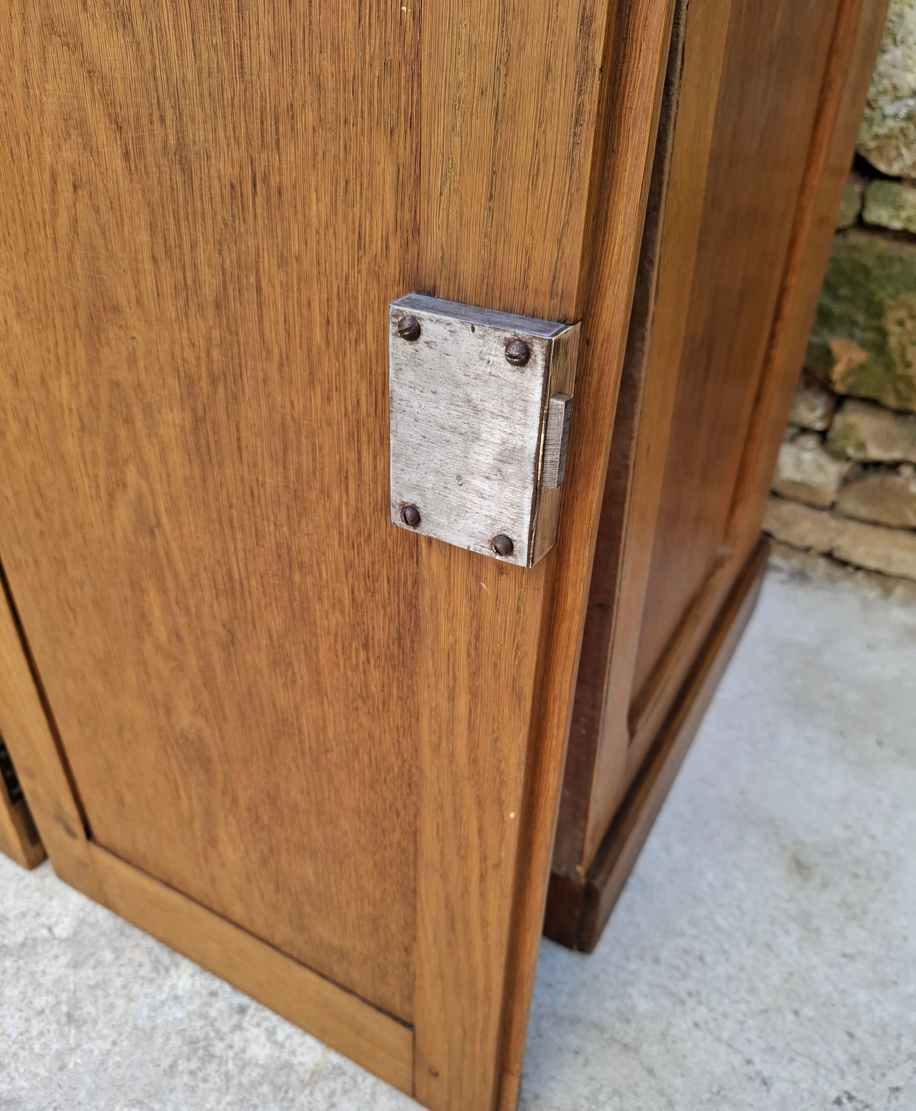 Oak workshop furniture with sliding doors.