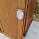 Oak workshop furniture with sliding doors.