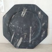 Decorative plate made of fossilised orthoceras marble.