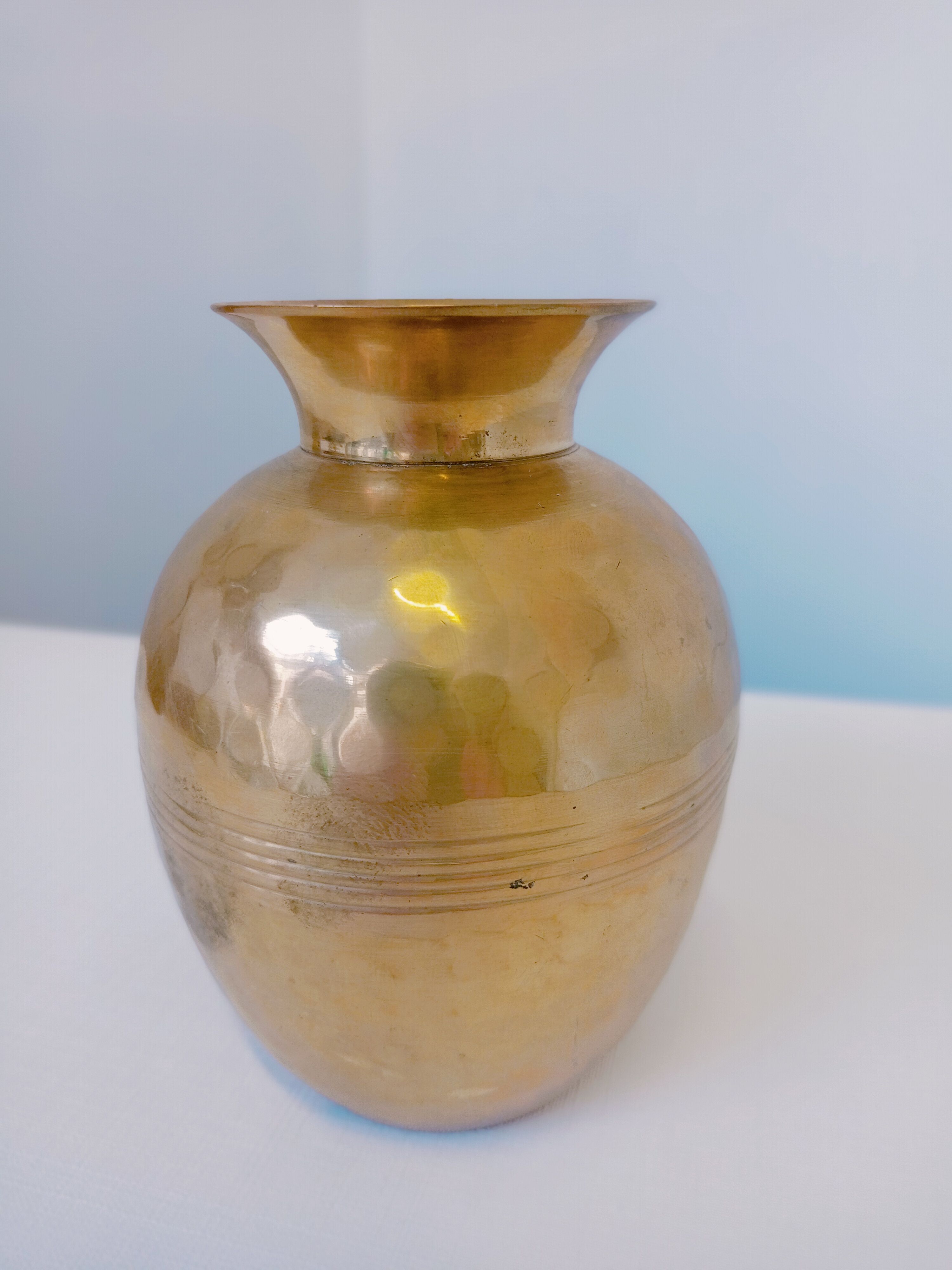 Hammered golden vase