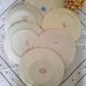 Pitted old flat earthenware plates with gold