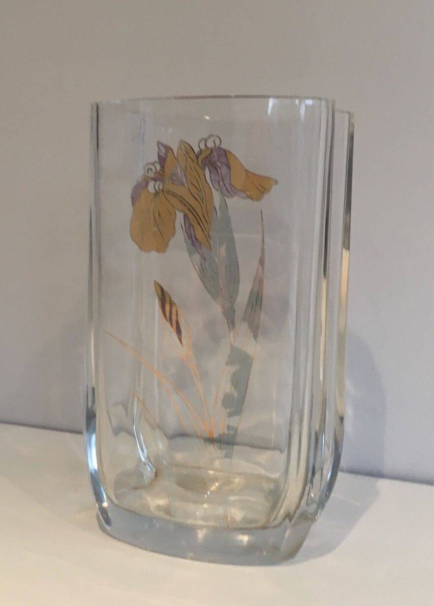 Glass vase with a decoration of a golden flower, around 1970.