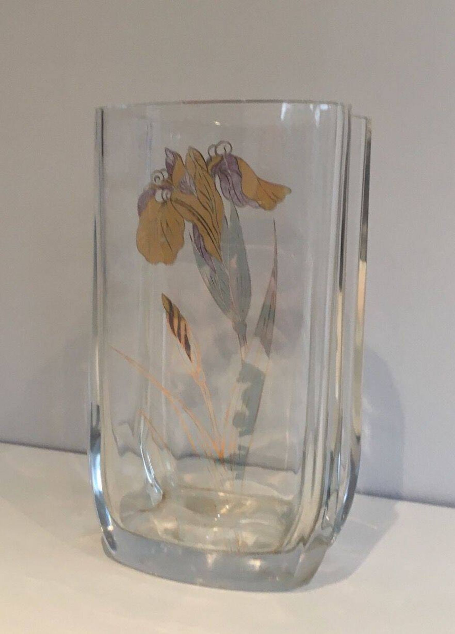 Glass vase with a decoration of a golden flower, around 1970.
