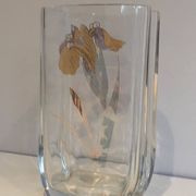 Glass vase with a decoration of a golden flower, around 1970.