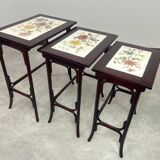 Nested tables in curved wood with ceramic top by Thonet.